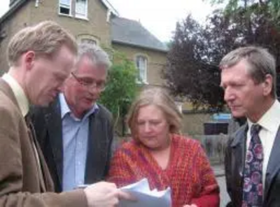 Maltese Road resident Bob Huntington in front of Courtman House, discussing its future with Marconi Councillors Jude Deakin and Graham Pooley (right), and Chelmsford Parliamentary Candidate Stephen Robinson